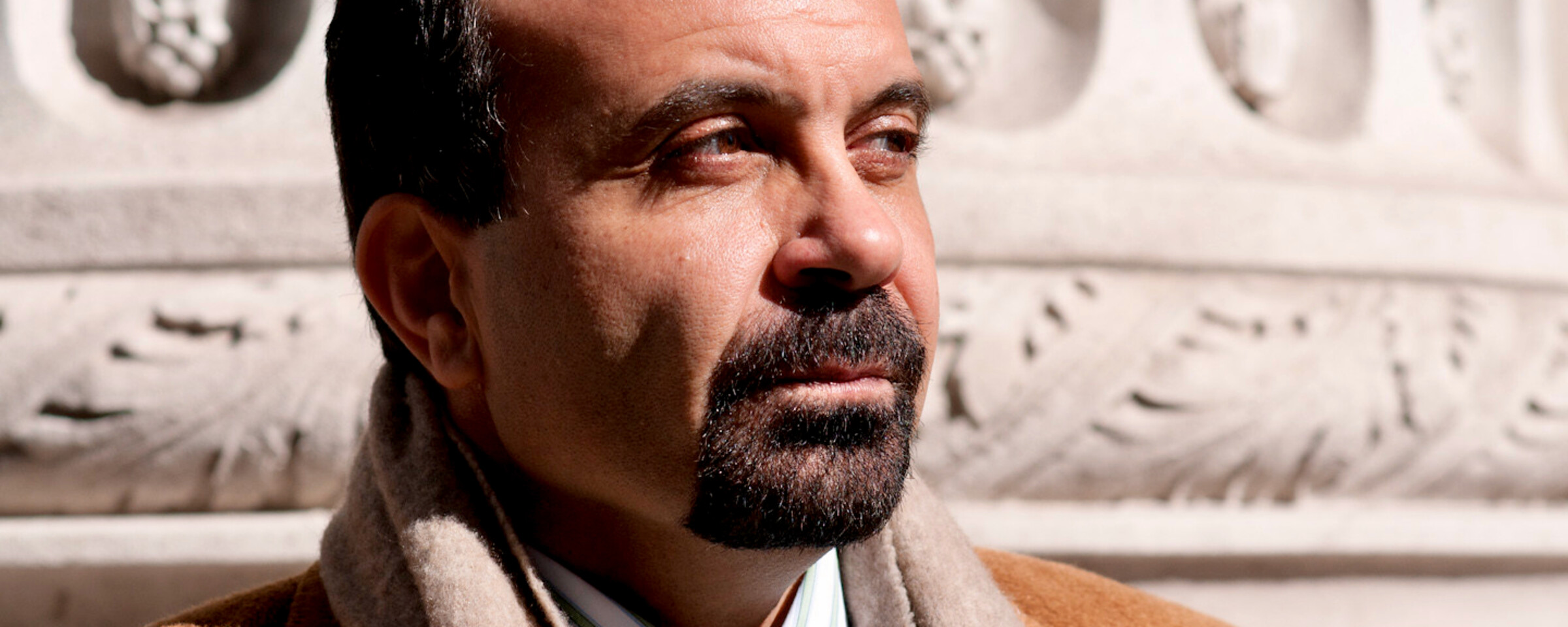 Portrait of Joseph Massad standing in front of neoclassical building