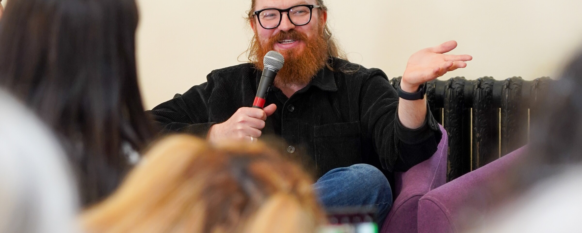 A man speaking into a microphone