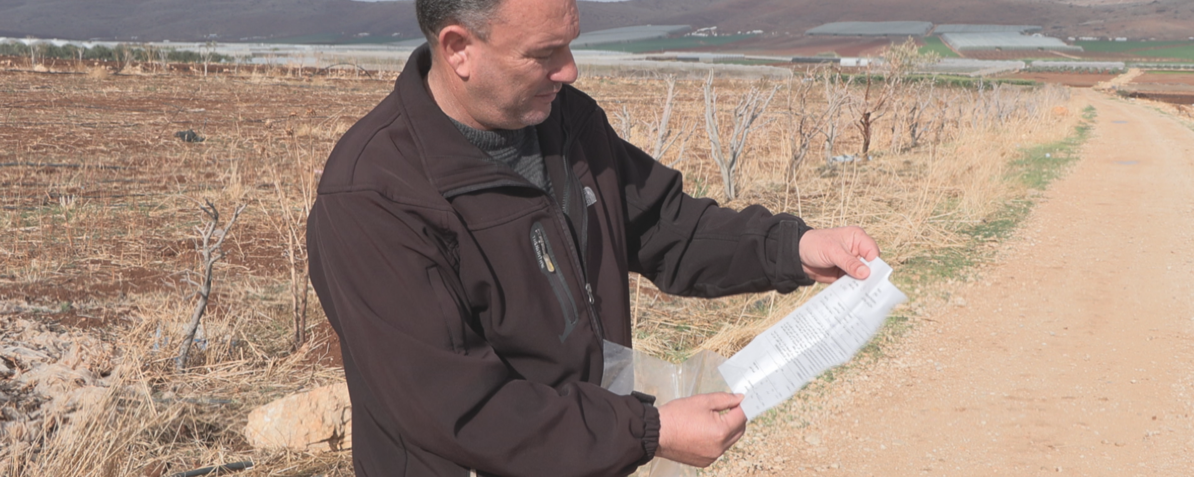 A man looks at a document