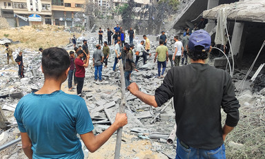 A number of people in the rubble of an area that Israel has attacked in Gaza City 
