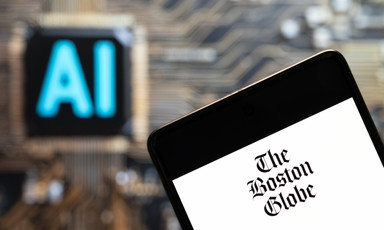 A table with the masthead of The Boston Globe 