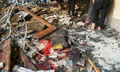 Broken items, debris and blood are scattered around in the aftermath of a bombing.