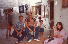 Photograph from the 1980s shows family sitting in refugee camp