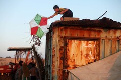 Musa, one Flying Paper's main characters, rescuing a kite. Musa, one Flying Paper's main characters, rescuing a kite.