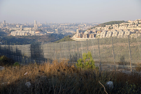 A barbed wire fence erected by Israel on occupied Palestinian land 