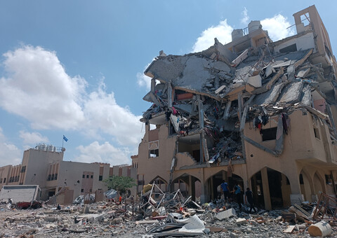 A bomb damaged building stands in ruins