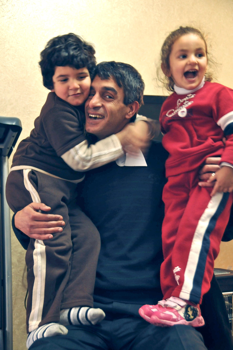 Taiseer Khatib embraces his small children
