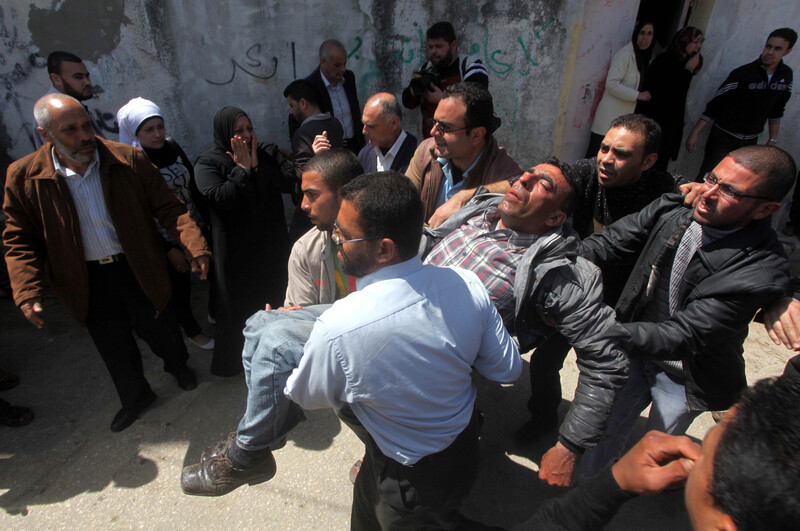 Fainted man is carried through crowd