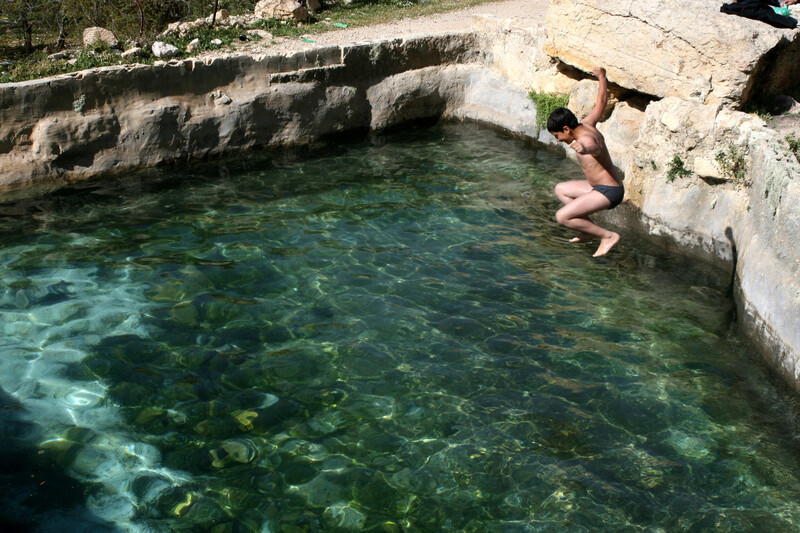 Boy jumps into spring