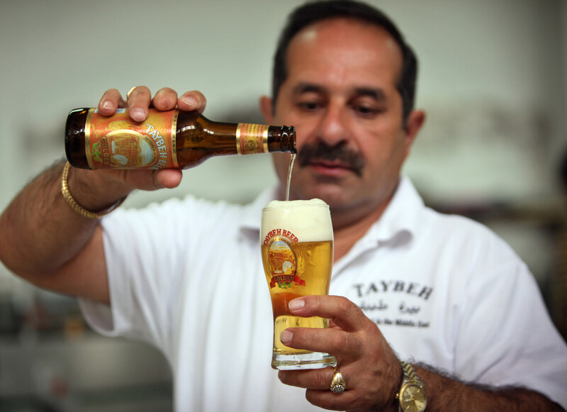 Man pours beer into glass