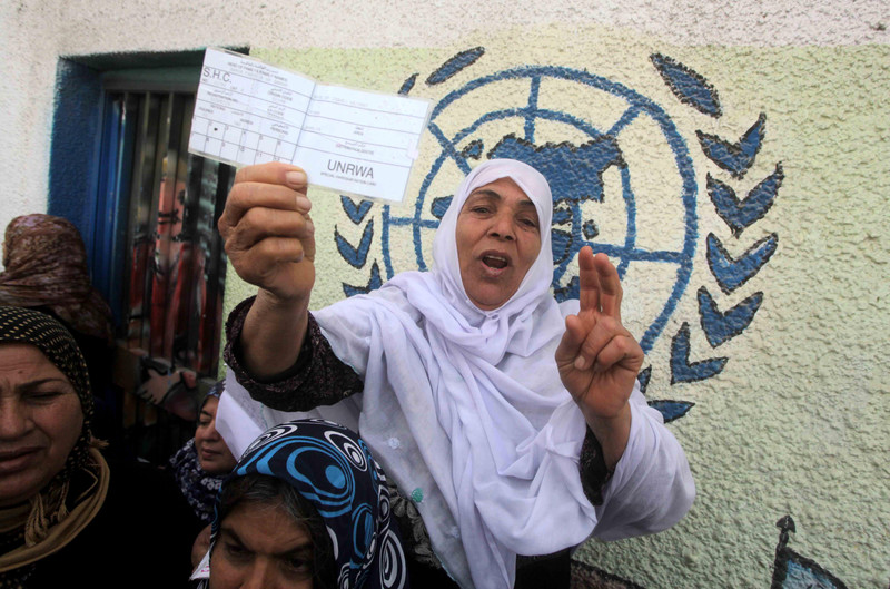 Woman displays ration card
