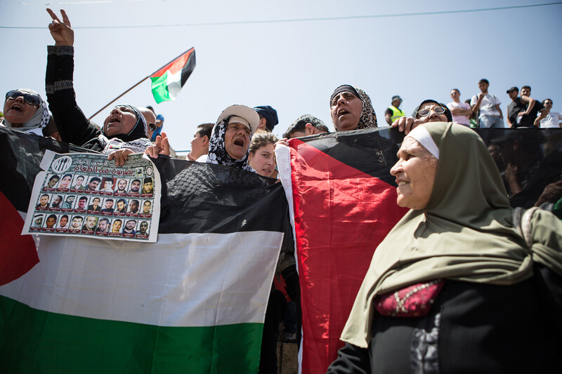 Women chant and carry banners