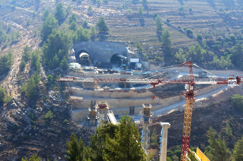 Landscape view of tunnels being built through hills