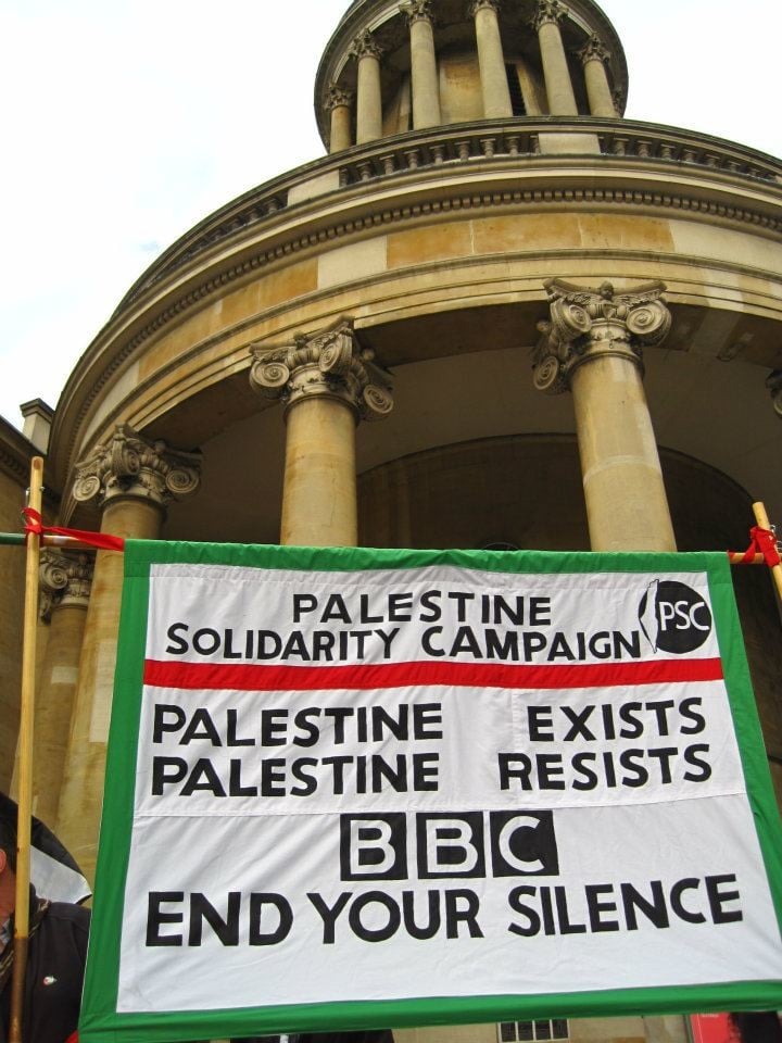 Banner reads: Palestine exists, Palestine resists, BBC end your silence
