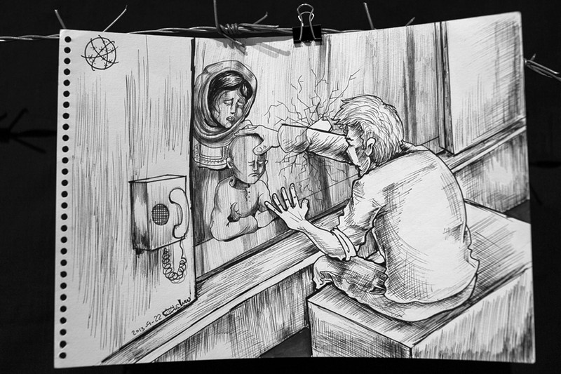Cartoon shows imprisoned man breaking through glass partition to touch child held by woman
