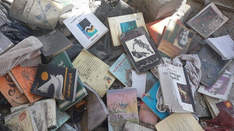 Burned books from the collection of Palestinian poet Othman Hussein