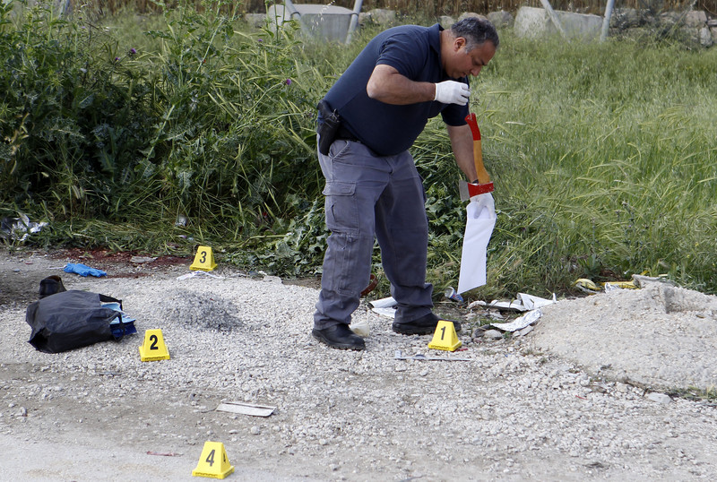 A man puts ax in plastic evidence bag
