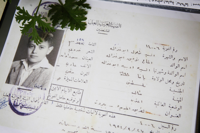 Official document showing photo of adolescent boy and his identification details in Arabic