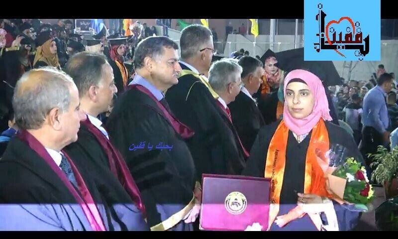 Young woman holding diploma walks past older men during graduation ceremony