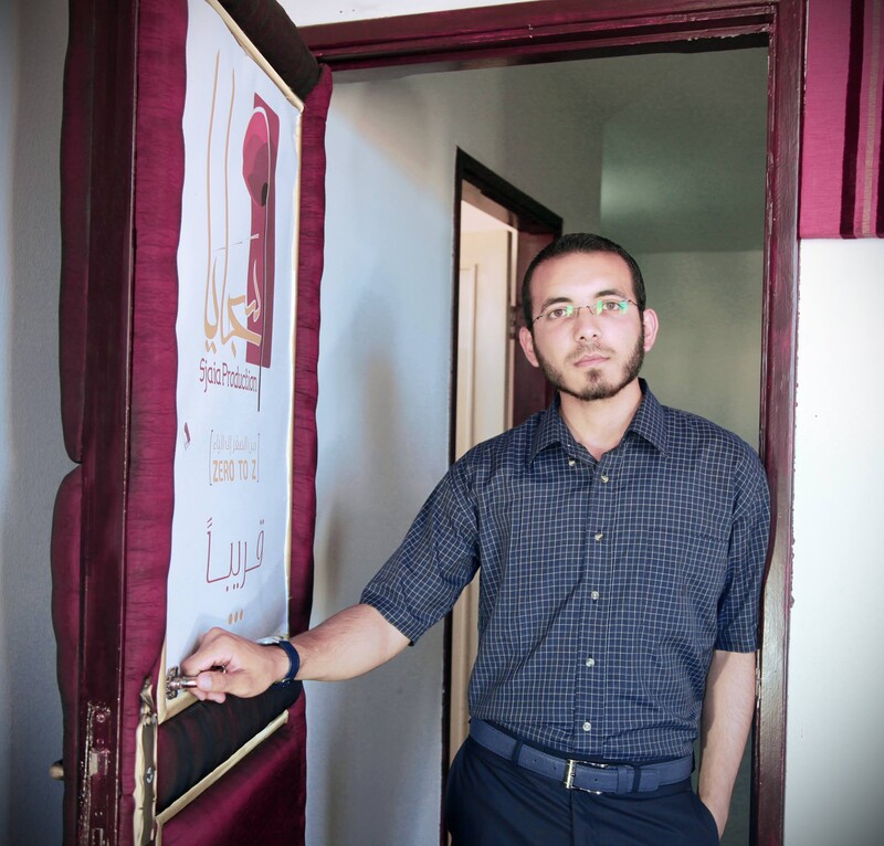 Man stands in office doorway