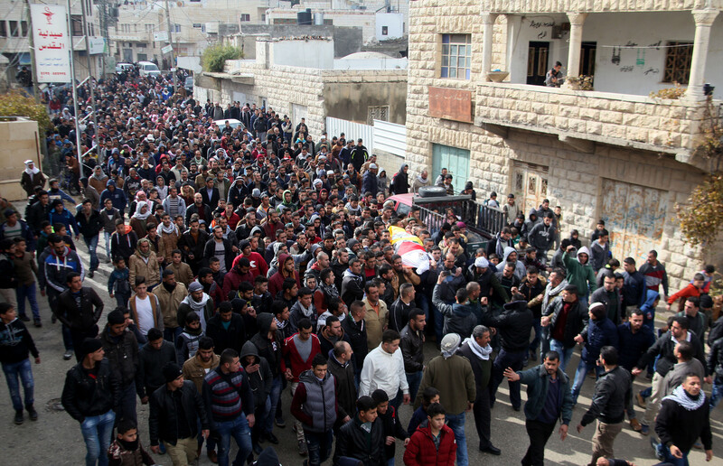 Dozens of people march in funeral procession