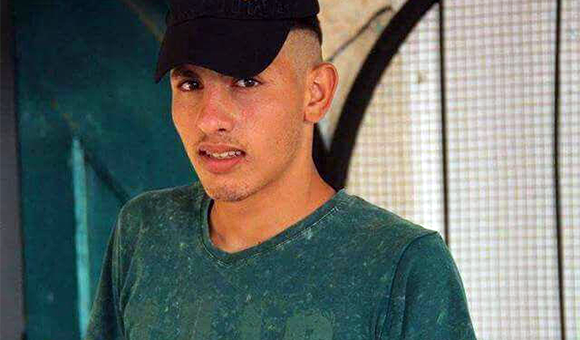 Young man wears T-shirt and baseball cap