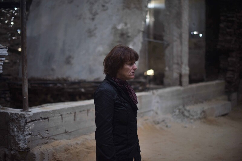 Artist Marjan Teeuwen stands in front of building