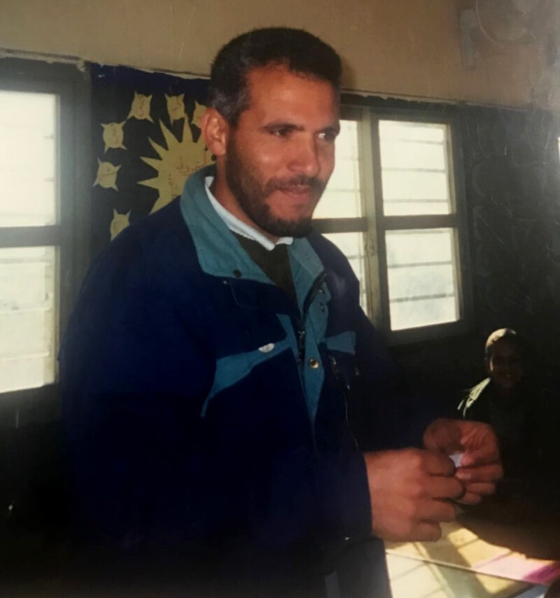 Candid photograph of smiling man