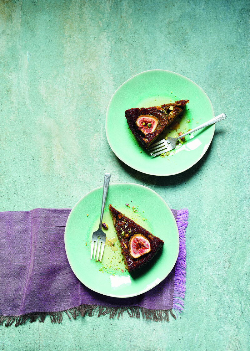 Photo shows aerial view of two slices of cake on dishes