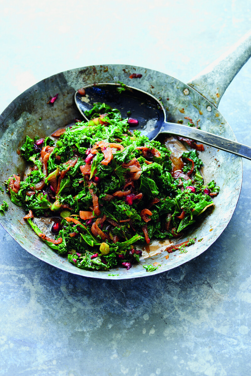 Photo of serving bowl containing julienned leaves, caramelized onions and pomegranate seeds