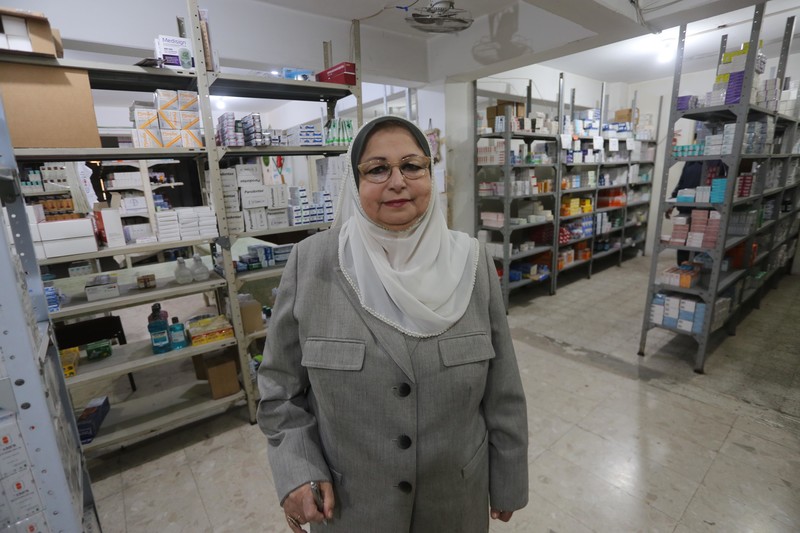 Hayfaa Shurrab stands in pharmacy stock room