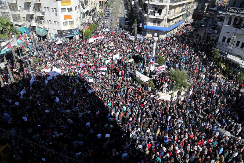 Palestinians take part during a protest against a social security law in Ramallah on October 2. 