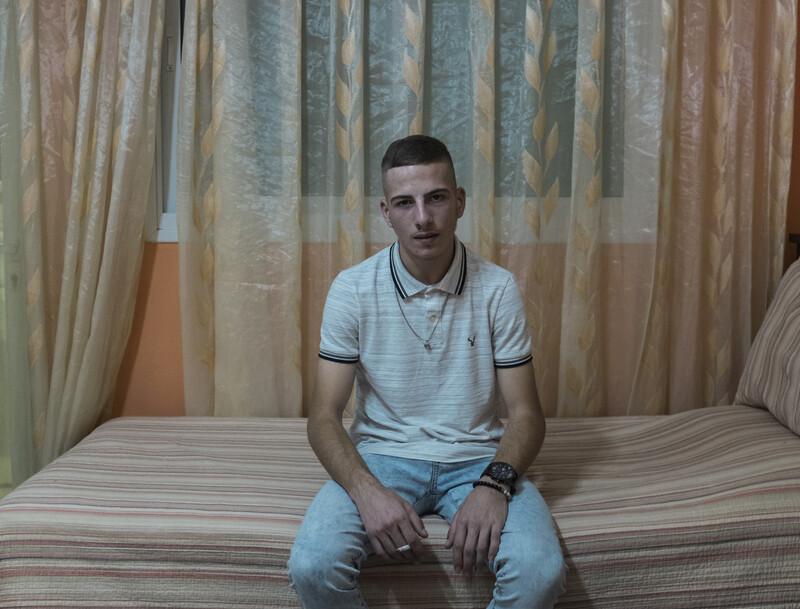 Ali Aleyeh sits on his bed.