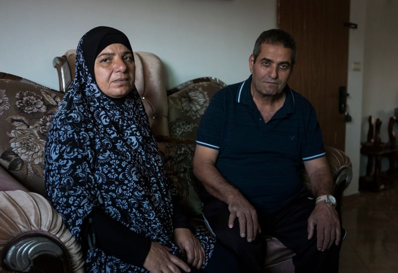 Fatma (left) and Jamal Elayan sit for a portrait in their temporary home 
