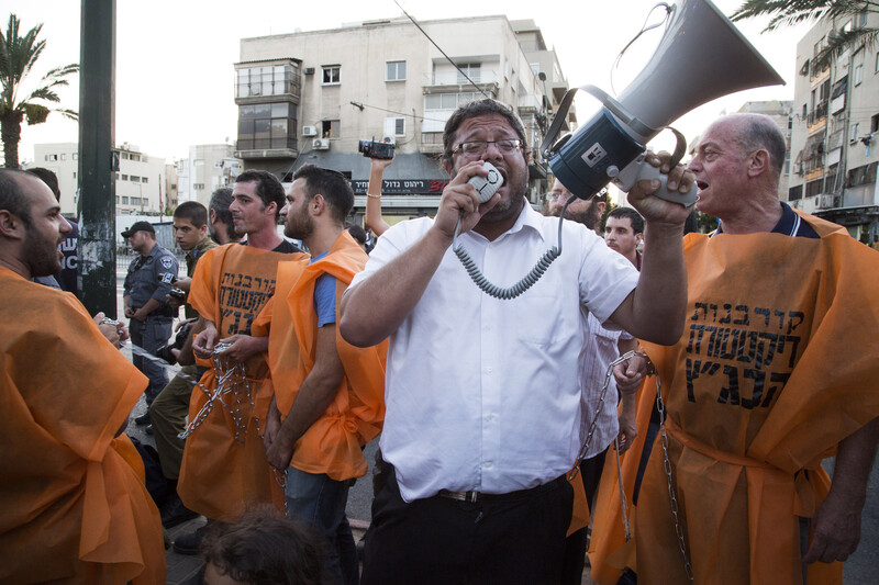 A man speaks into a megaphone