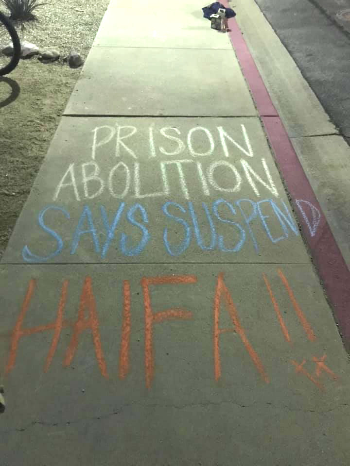 Students wrote Prison Abolition says suspend Haifa! in chalk on Pitzer campus.