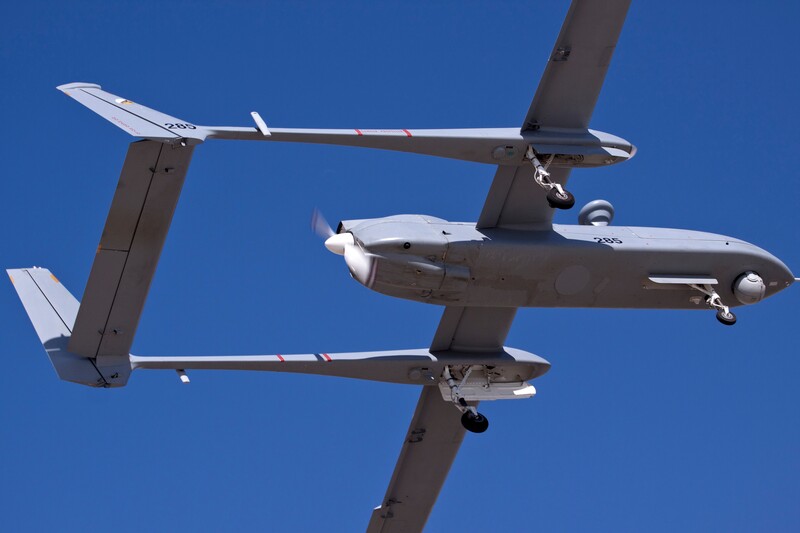 An Unmanned Aerial Vehicle is seen against a blue sky