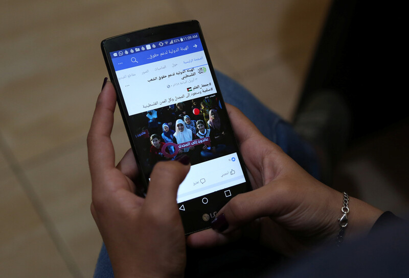 A woman's hands on her phone