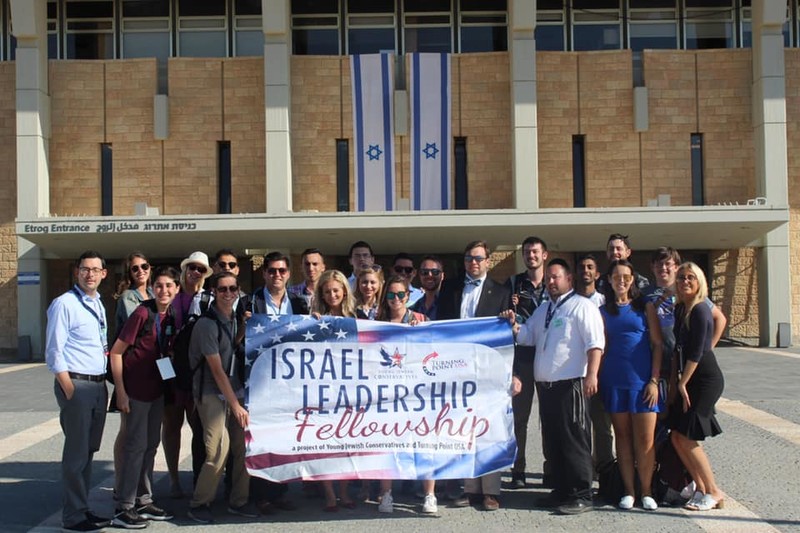 Trip participants stand outside the Knesset