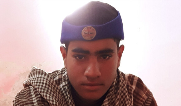 Teenage boy wearing knit cap