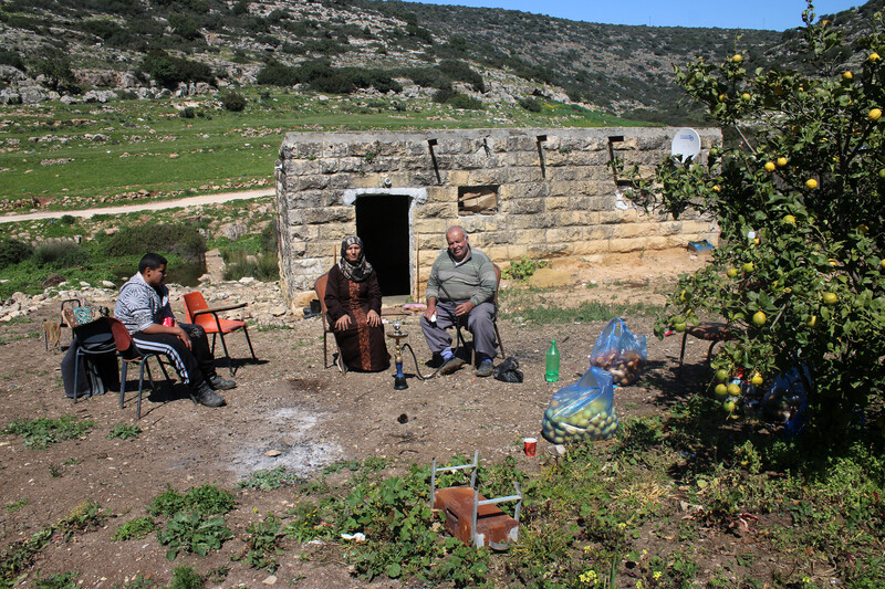 A Palestinian family sits together