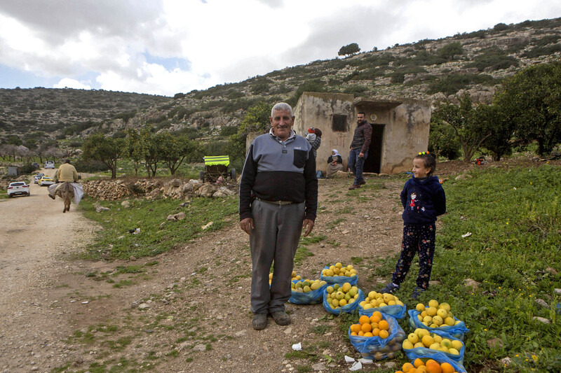 A man and child with fruit