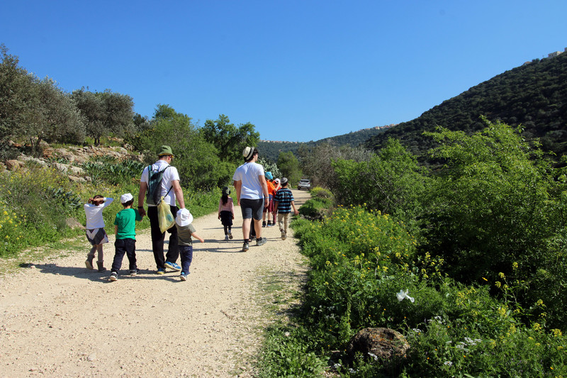 Israelis walking with children