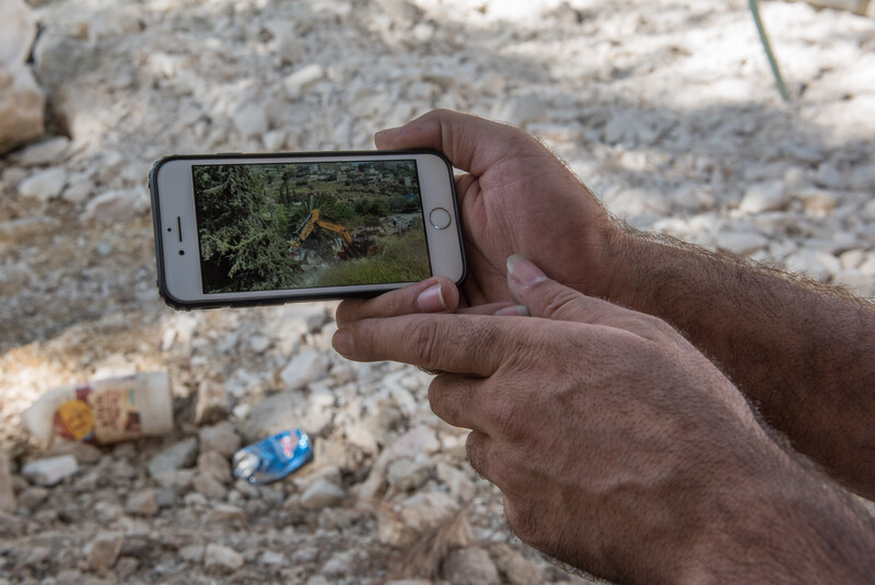 Two hands hold a mobile phone