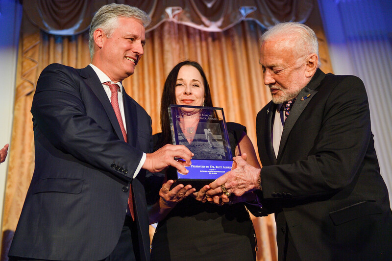 Robert O'Brien presents Buzz Aldrin with the Richard Nixon Greatest Comeback Award. (Jeff Gritchen / ZUMA Press) Man receives award