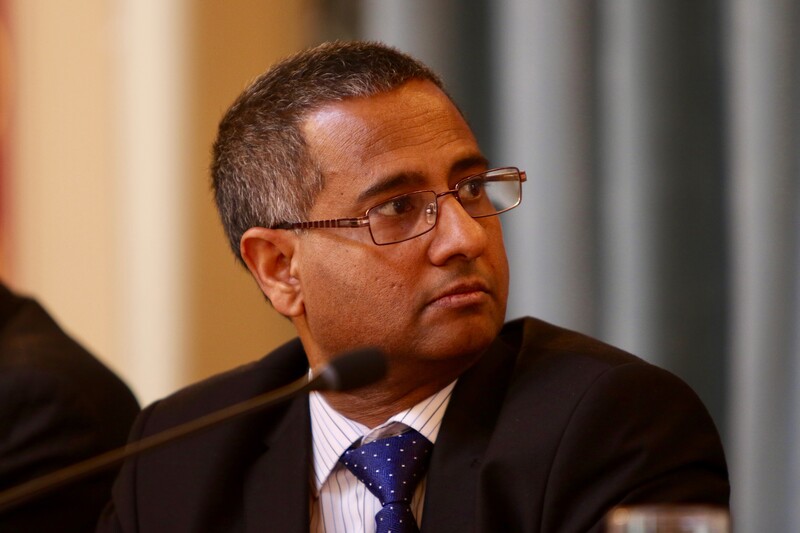 Close up of man seated in front of microphone