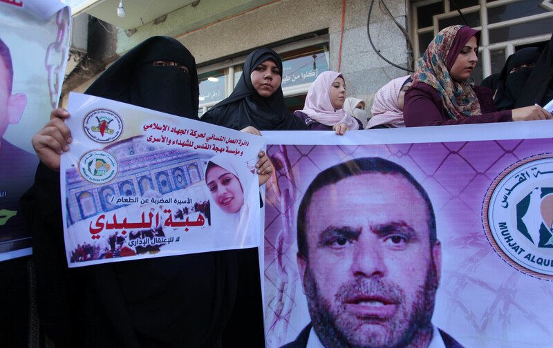 People hold banners