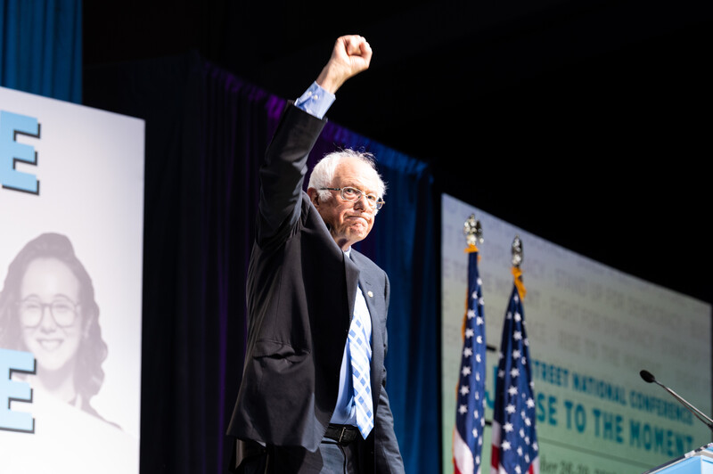Senator Bernie Sanders addressed J Street on Monday. Man raises fist
