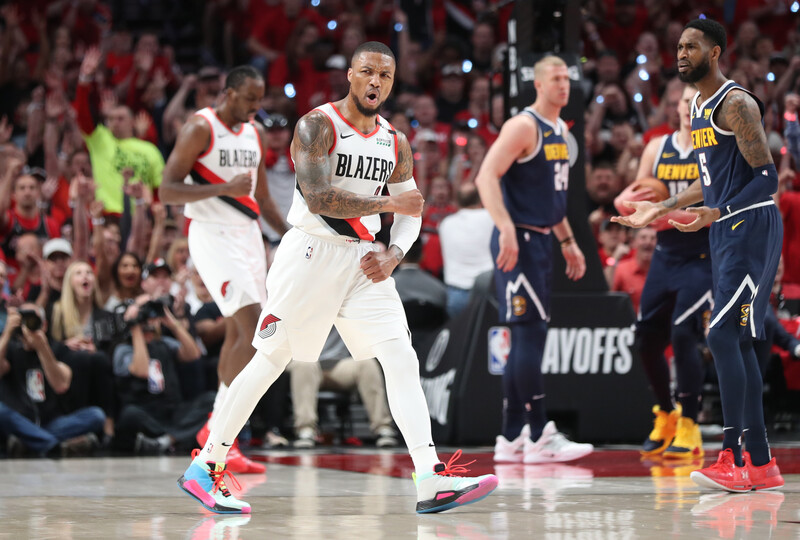 A basketball player walks on the court