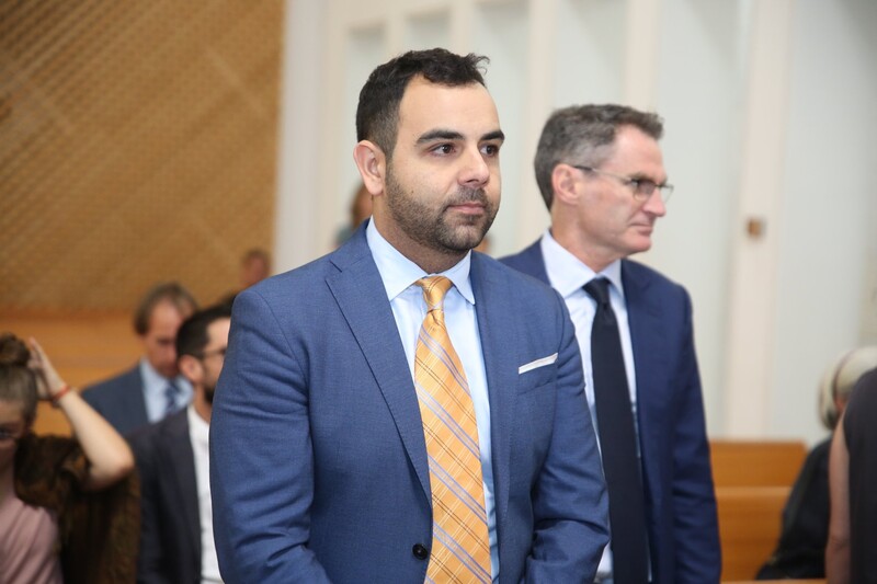 Man wearing suit and tie in court